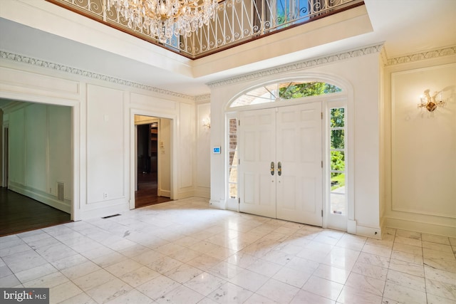 entryway with a notable chandelier and a high ceiling