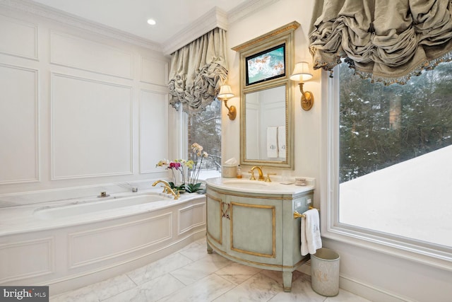 bathroom featuring vanity, a bathing tub, and ornamental molding