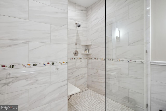 bathroom with a tile shower