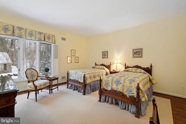 bedroom with wood-type flooring