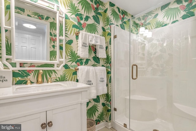 bathroom featuring an enclosed shower and vanity