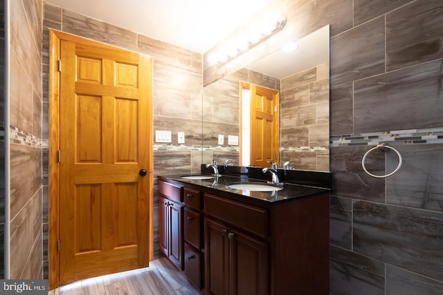 bathroom featuring tile walls and vanity