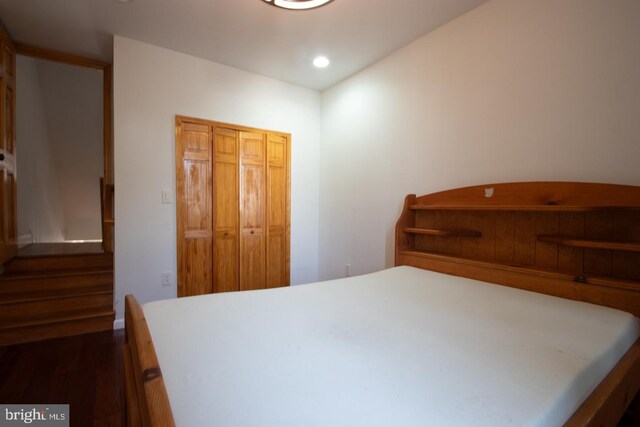 bedroom featuring a closet and hardwood / wood-style flooring