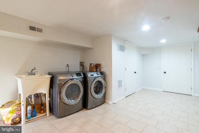 laundry area with washing machine and dryer