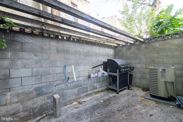 view of side of property featuring central air condition unit