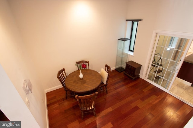 dining area with dark wood-type flooring