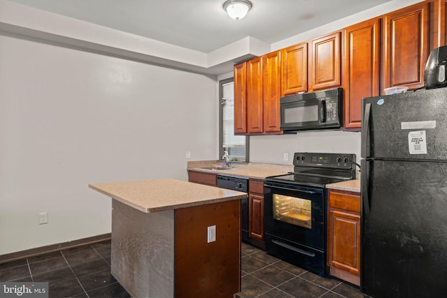 kitchen featuring dark tile patterned flooring, black appliances, a kitchen island, and sink