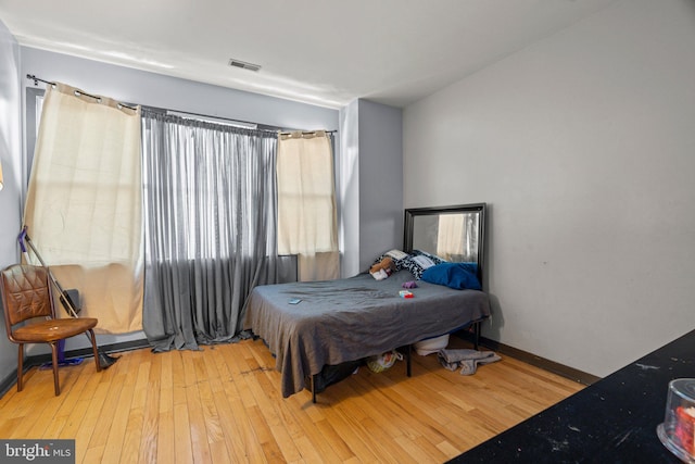 bedroom with light hardwood / wood-style floors