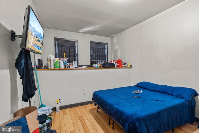 bedroom with light hardwood / wood-style floors