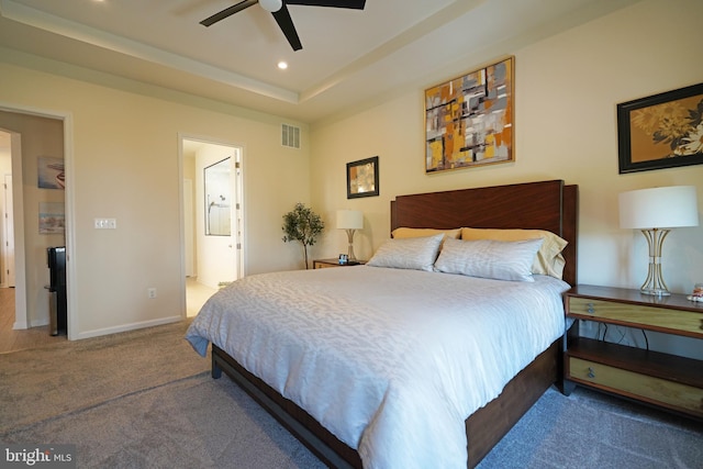 carpeted bedroom with ceiling fan and ensuite bathroom