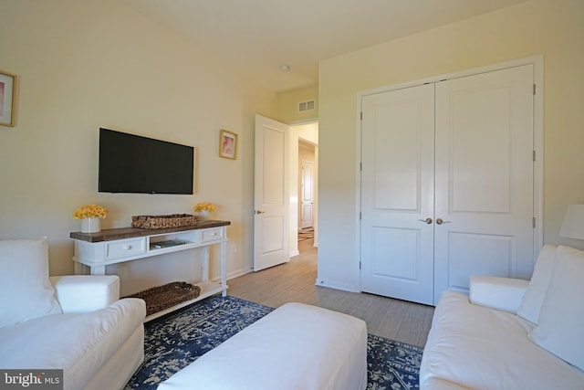 bedroom featuring a closet and light wood-type flooring