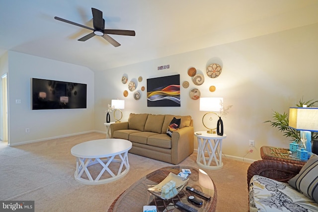 carpeted living room with ceiling fan