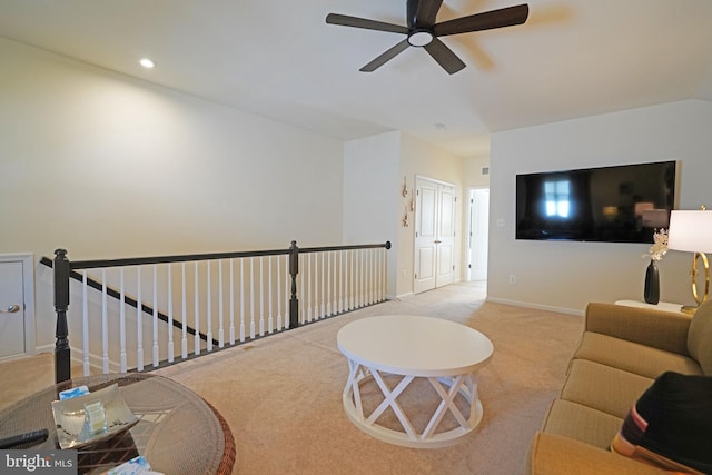 living room with ceiling fan and light carpet