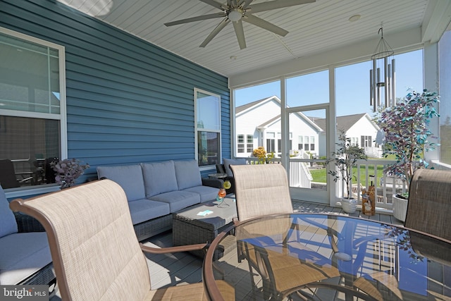 sunroom with wood ceiling and ceiling fan