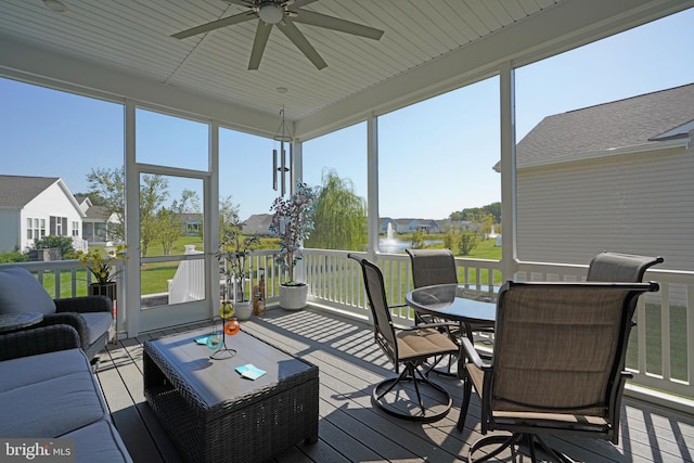 sunroom / solarium with ceiling fan