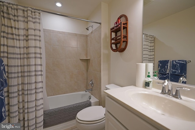 full bathroom with toilet, shower / tub combo, and vanity