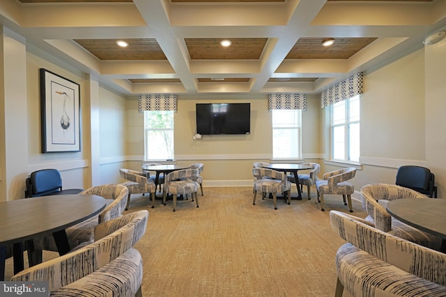 dining area featuring coffered ceiling, a wealth of natural light, and beam ceiling