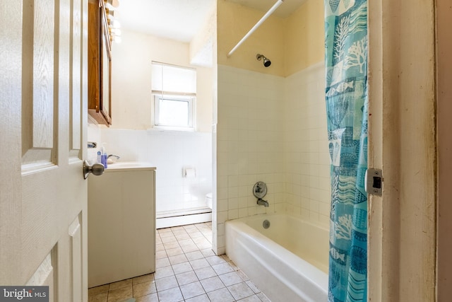 full bathroom featuring shower / bathtub combination with curtain, vanity, baseboard heating, toilet, and tile patterned floors