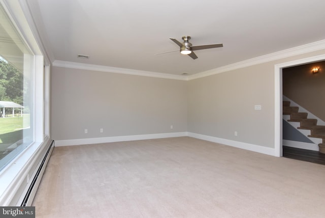 carpeted empty room with ceiling fan, baseboard heating, and ornamental molding