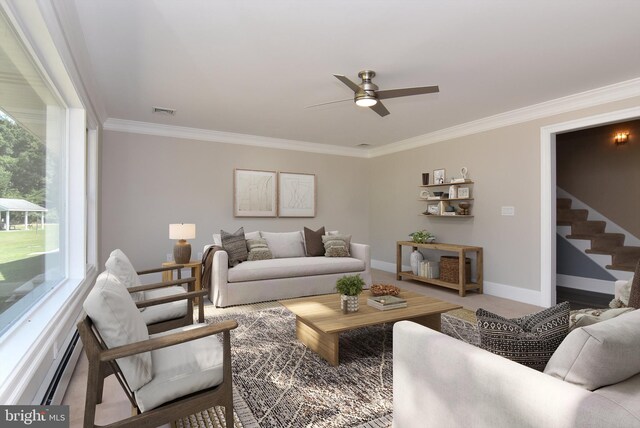 living room featuring stairway, baseboards, visible vents, a baseboard heating unit, and crown molding