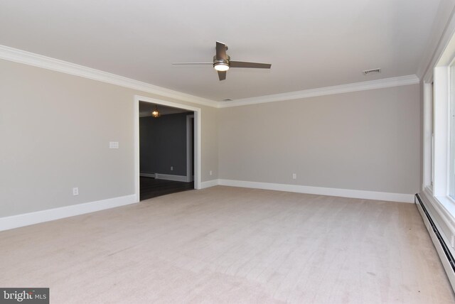 empty room with ornamental molding, a baseboard radiator, ceiling fan, and carpet flooring