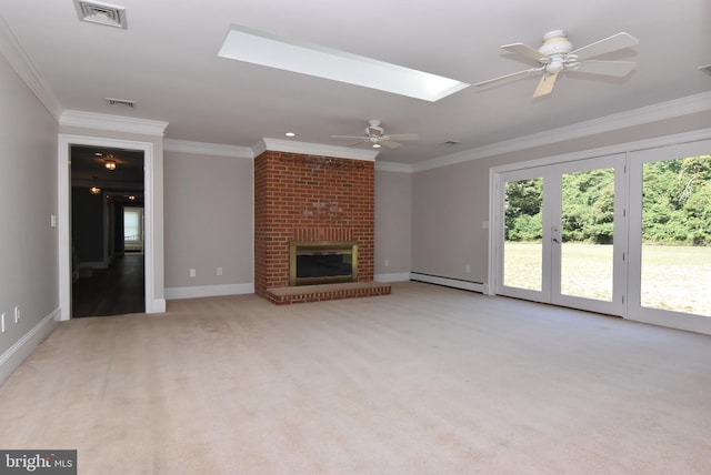 unfurnished living room with a fireplace, crown molding, a baseboard radiator, ceiling fan, and light colored carpet