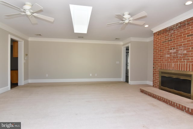 unfurnished living room featuring ornamental molding, a brick fireplace, and ceiling fan