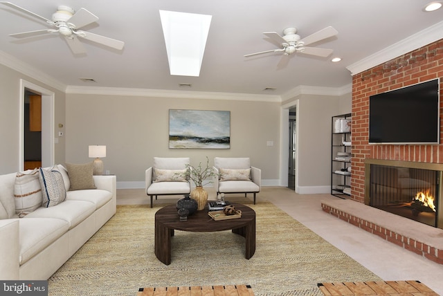 living room featuring baseboards, carpet floors, ornamental molding, and a ceiling fan