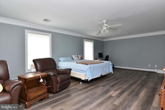 bedroom with dark wood-style floors, baseboard heating, and crown molding