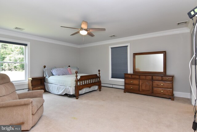 carpeted bedroom featuring a baseboard heating unit, ceiling fan, and crown molding