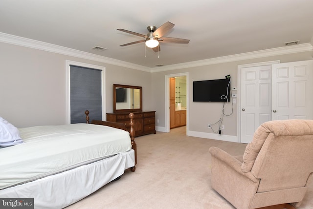 carpeted bedroom with a closet, ceiling fan, ornamental molding, and ensuite bath