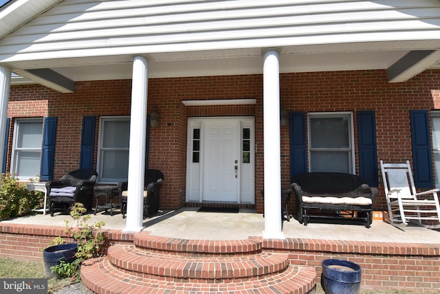 entrance to property with covered porch