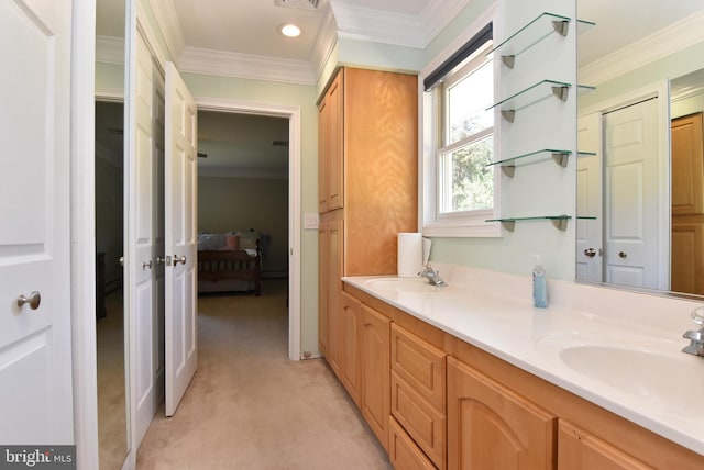 bathroom with double vanity, ornamental molding, and a sink