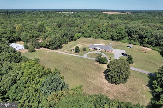 aerial view with a rural view and a wooded view