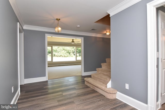 staircase with hardwood / wood-style floors, a baseboard radiator, crown molding, and ceiling fan