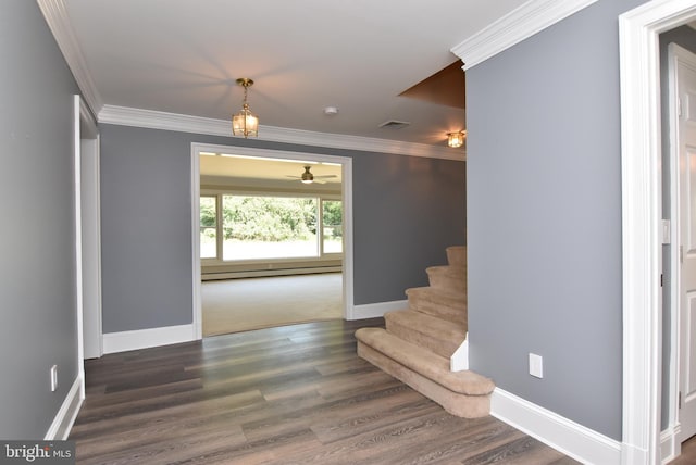 interior space featuring visible vents, crown molding, baseboards, baseboard heating, and dark wood-style floors