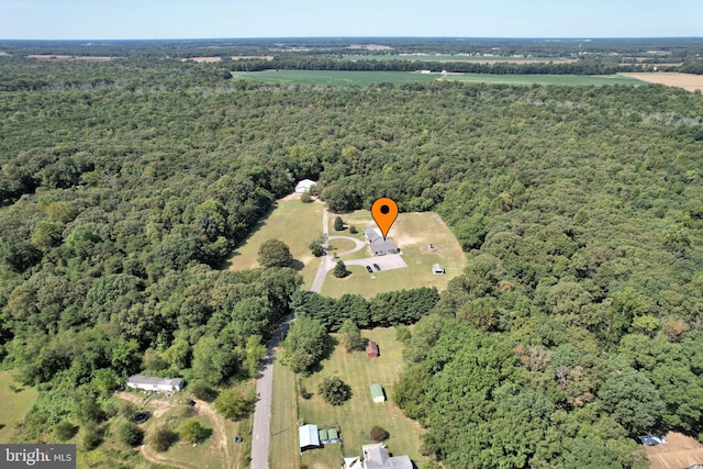 aerial view featuring a view of trees