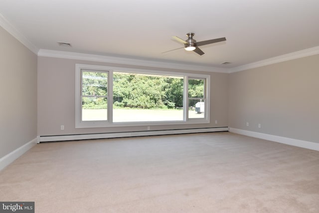 carpeted empty room with a healthy amount of sunlight, ceiling fan, and ornamental molding