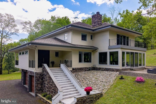 rear view of property with a yard