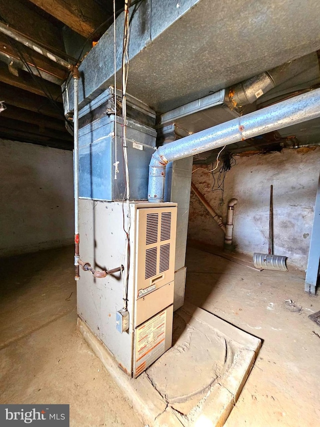 utility room with heating unit