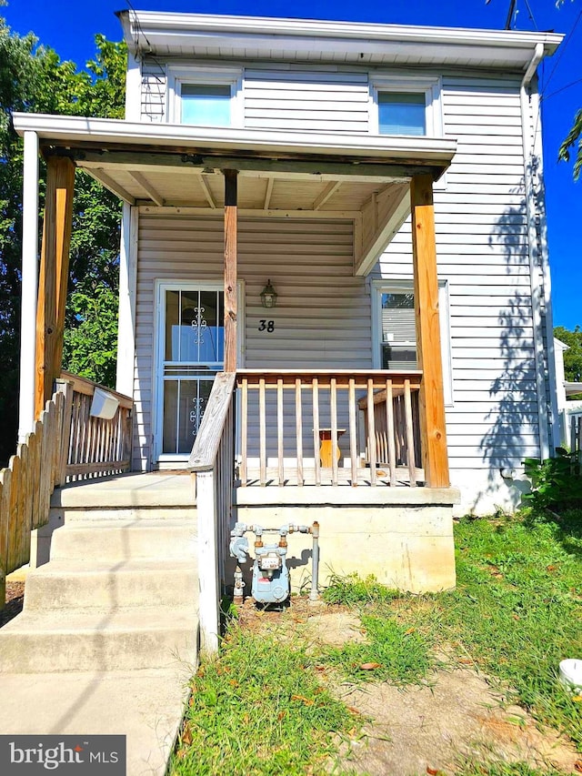 doorway to property with a porch