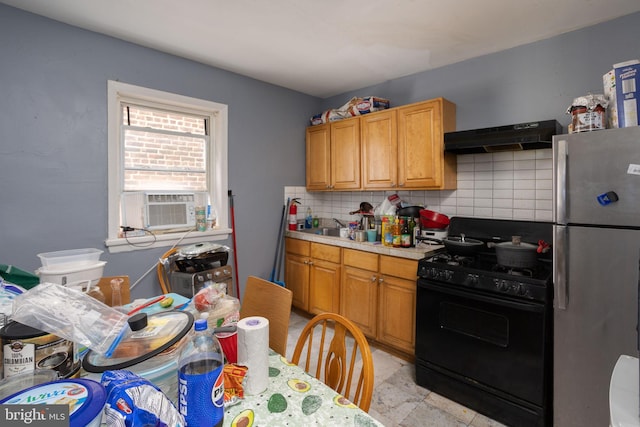 kitchen featuring stainless steel fridge, extractor fan, sink, decorative backsplash, and black gas range