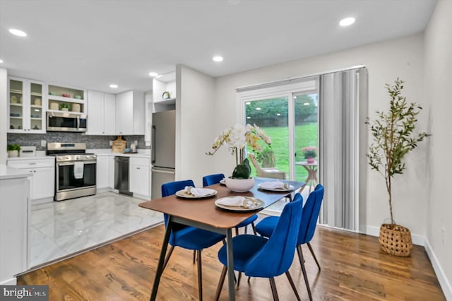 dining room featuring light hardwood / wood-style floors