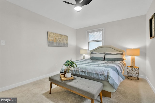 bedroom featuring ceiling fan and light colored carpet