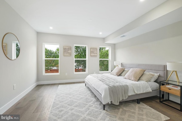 bedroom with hardwood / wood-style flooring