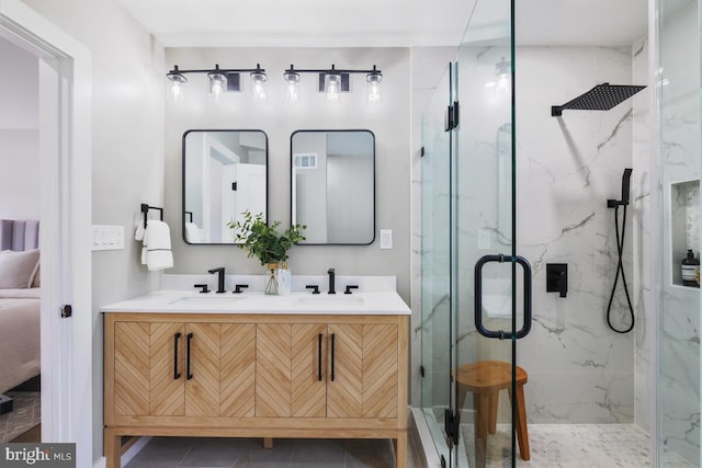 bathroom with walk in shower, tile patterned flooring, and vanity