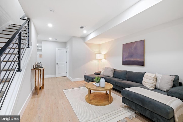 living room with light hardwood / wood-style flooring