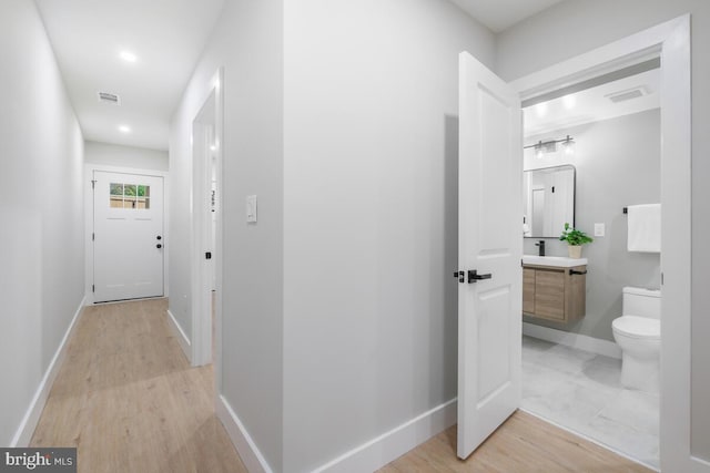 hallway featuring light hardwood / wood-style floors