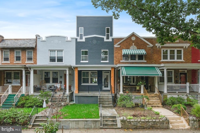 multi unit property featuring a porch