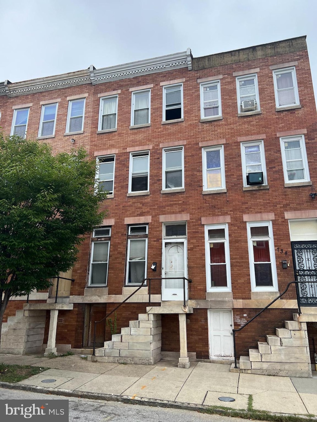 view of property featuring brick siding